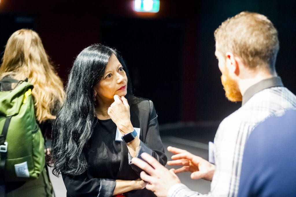 Professor Jayashri Kulkarni AM FAHMS talks to an attendee at the 2019 Life as a Clinician-Scientist Victoria symposium.