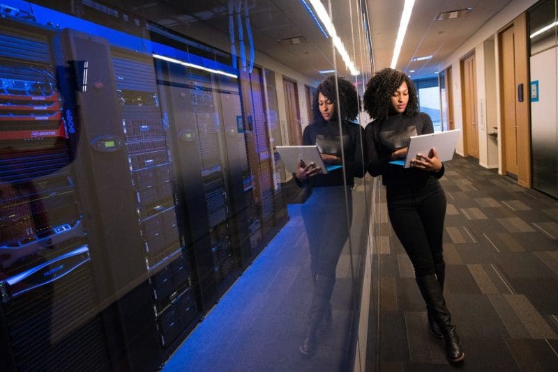 Submission to AHPRA draft data strategy. Image of woman in a data centre with a laptop.